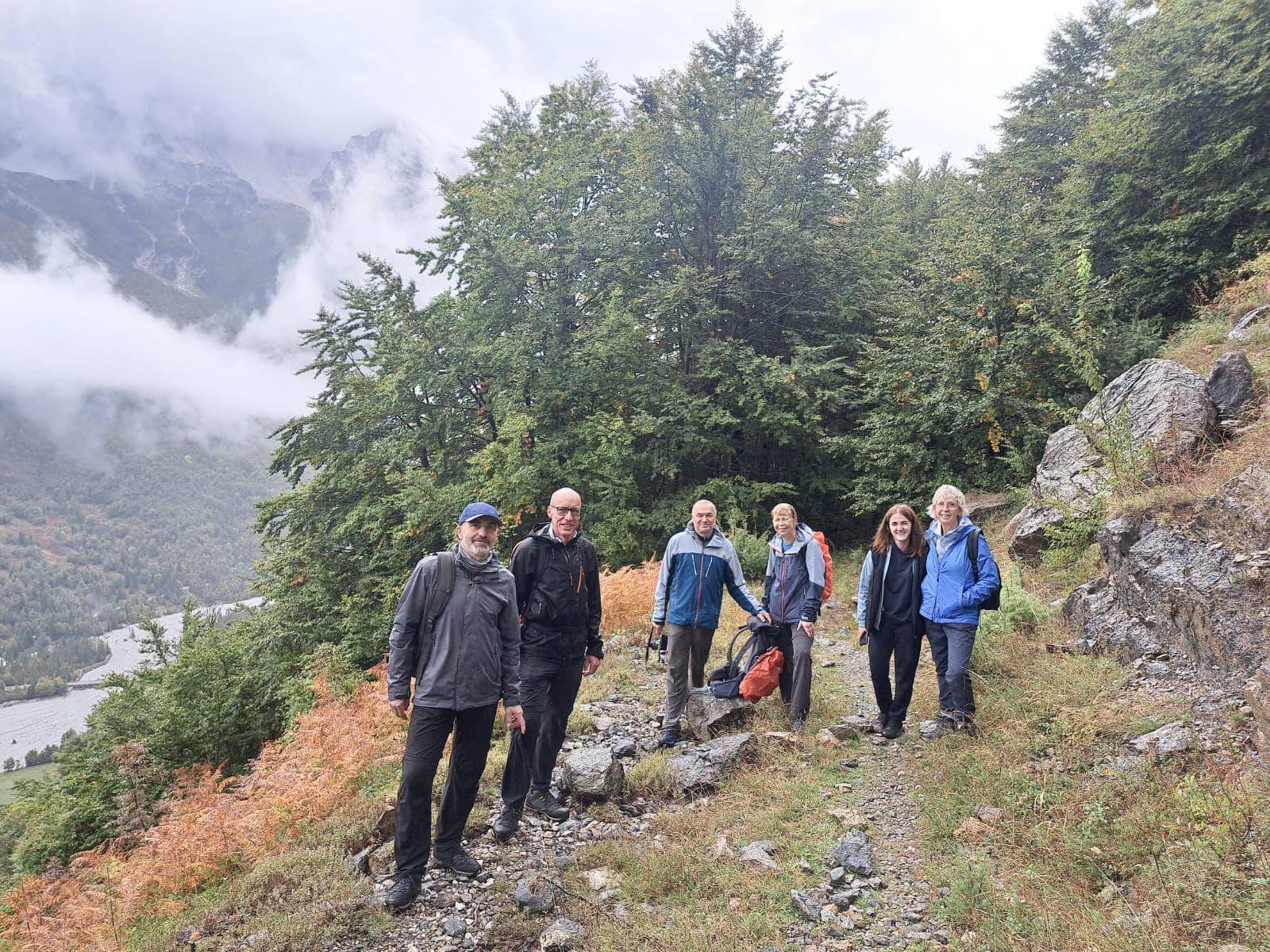 Walking group on a mountain trail near Valbona in the Albanian Alps